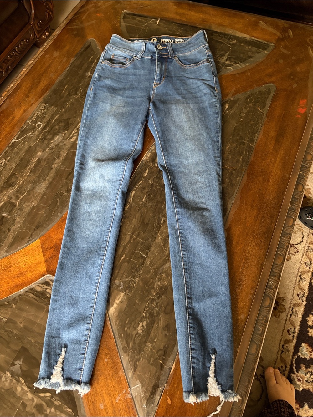 High-Rise Skinny Jeans with Distressed Hem - Medium Blue